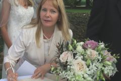 celebrant signing the registry